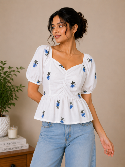 White Top With Blue Floral Embroidered Peplum Top