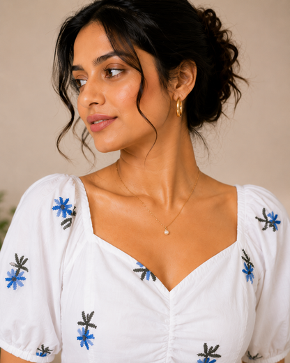 White Top With Blue Floral Embroidered Peplum Top